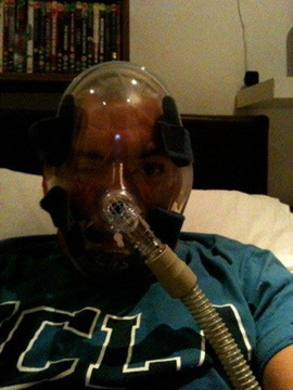 Wearing my breathing mask—another part of adapting to life after my operation.