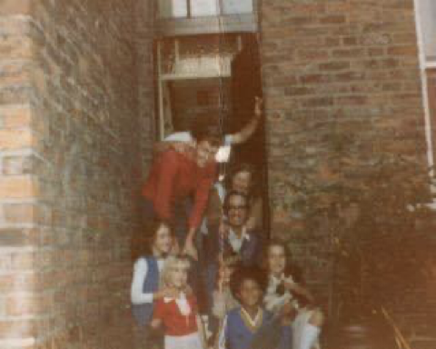 Nine-year-old Chris surrounded by his foster family.