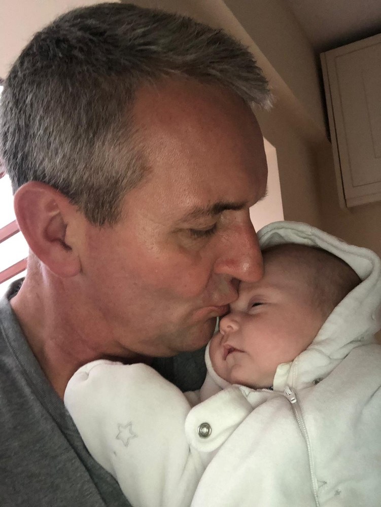 My good friend sharing a precious moment with his newborn daughter.