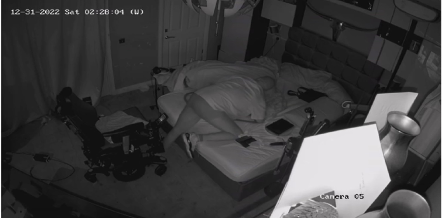 CCTV still at 02:28 showing Chris attempting another transfer into the wheelchair