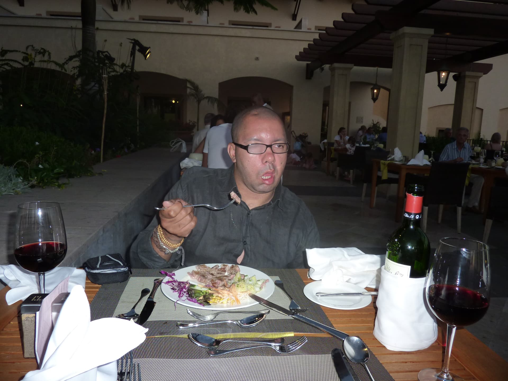 Chris enjoying dinner outdoors on holiday