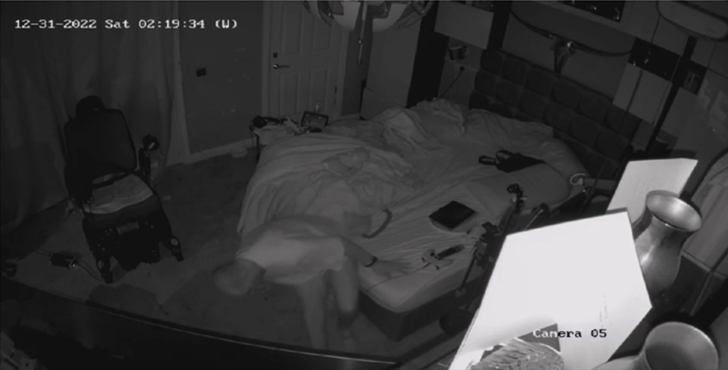 CCTV still at 02:19 showing Chris on the floor moving towards his wheelchair