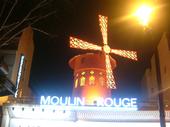 The glowing Moulin Rouge windmill—a lasting memory from the Paris trip I shared with my girlfriend.