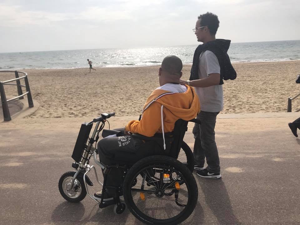 Looking across Bournemouth beach with my carer—enjoying the sea air and the freedom to get out and experience life.